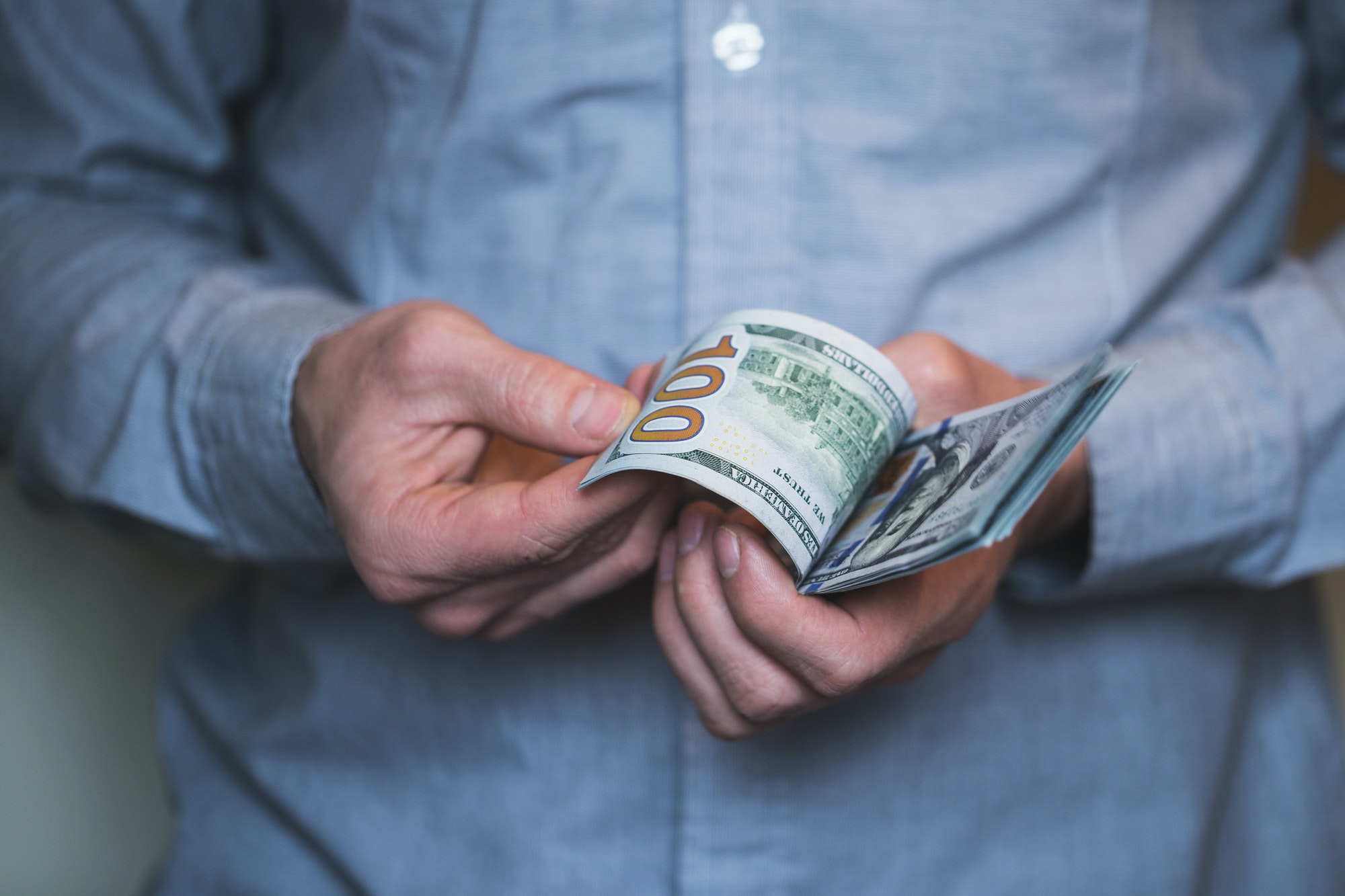 Businessman holding money in his hands