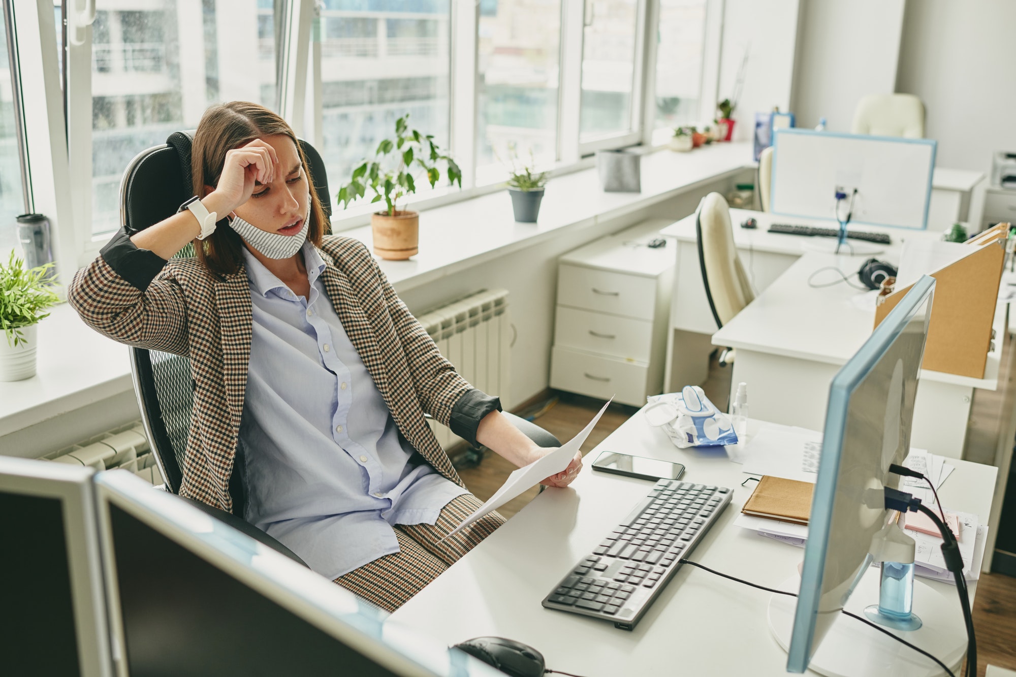 Frustrated woman in empty office