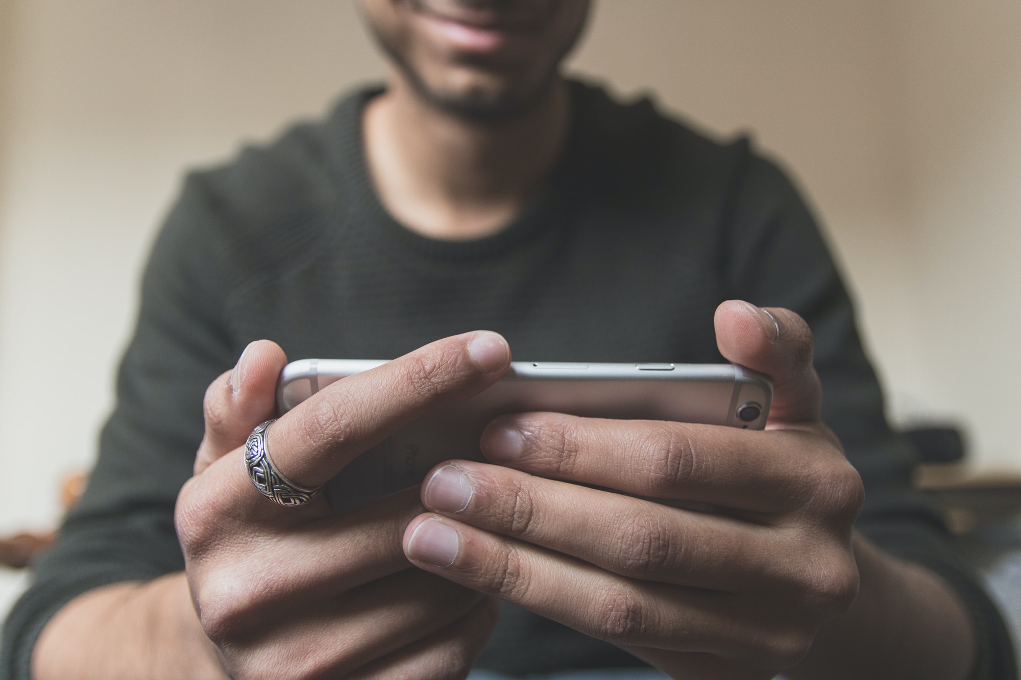 Man watching video on a smartphone.