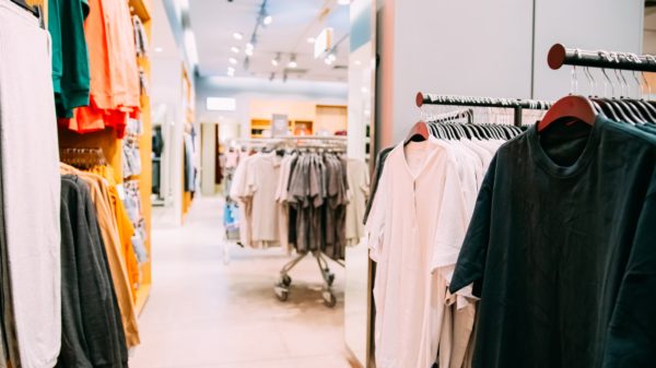 Many Male One-colour T-shirt On Hanger In Store Of Shopping Cent