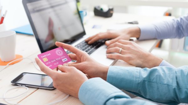 Married couple shopping online at home