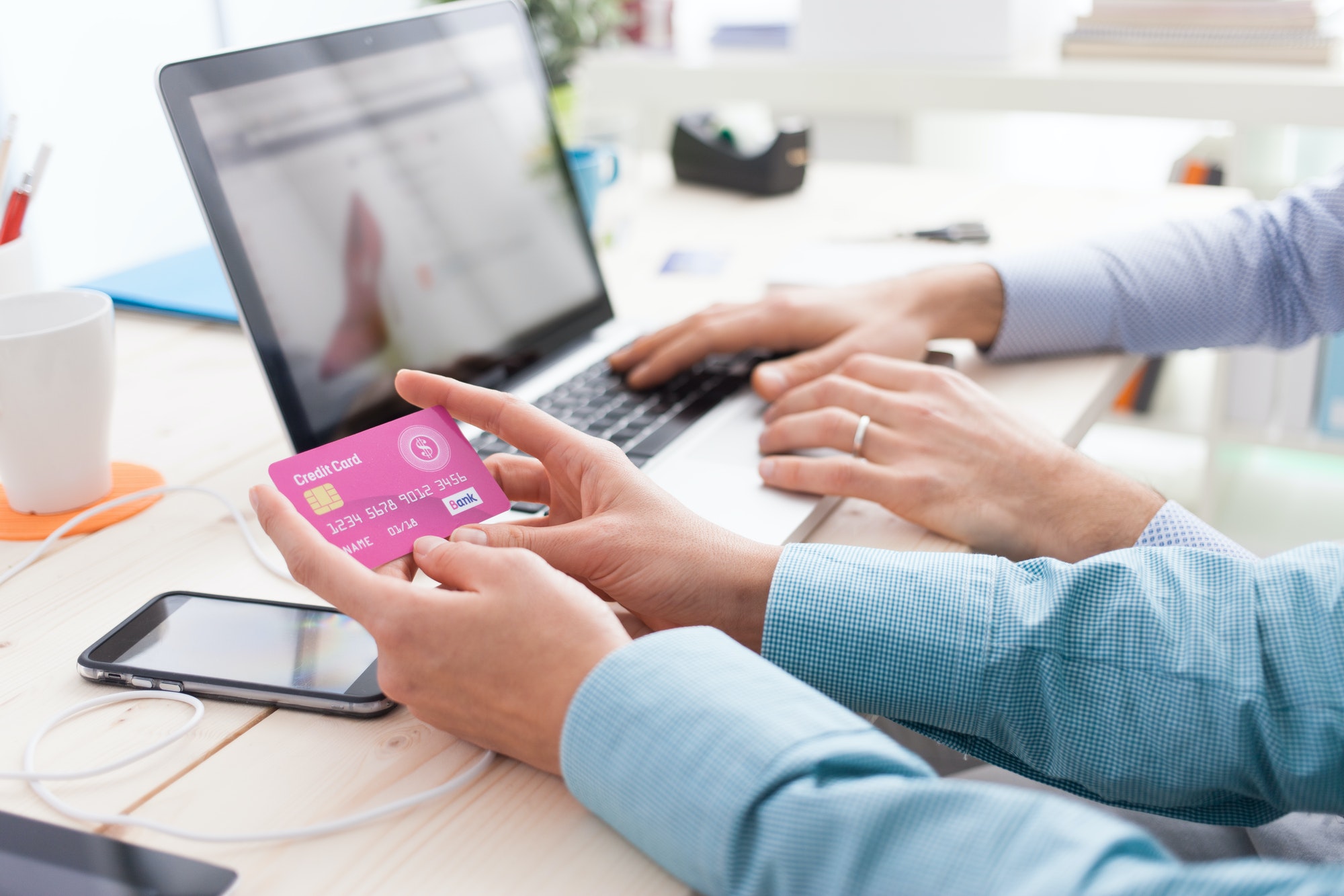 Married couple shopping online at home