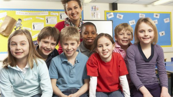 Schoolchildren In classroom with teacher