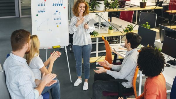 Woman team leader making presentation for colleagues