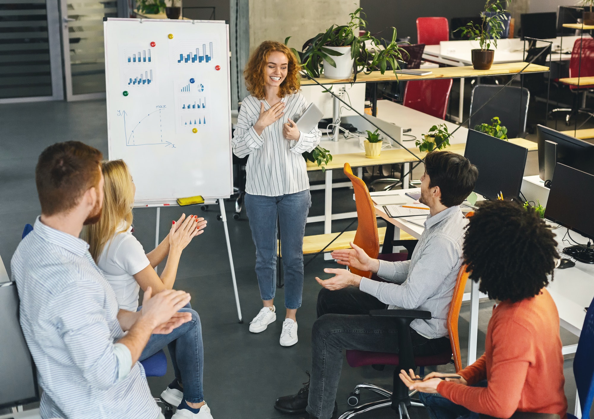 Woman team leader making presentation for colleagues