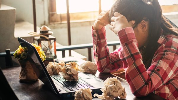 Women with stressful on the table.